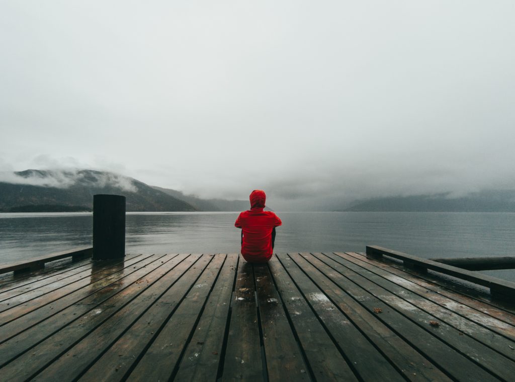 lonely guy sitting how to stop feeling lonely